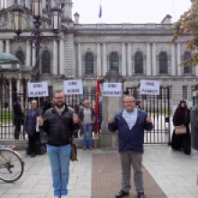 Protesters gather outside Belfast City Hall . . .
