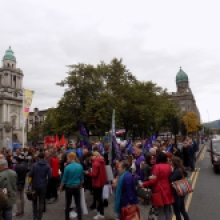People gather outside Belfast City hall to protest in favor of letting refugees into Ireland.